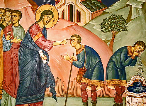 Religious mural depicting Jesus healing a blind man in a biblical scene with onlookers and a church background