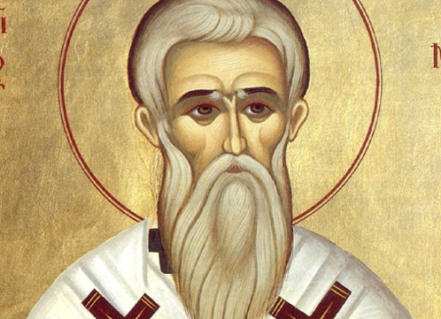 Religious icon depicting a bearded man in white robes with a gold halo against a golden background
