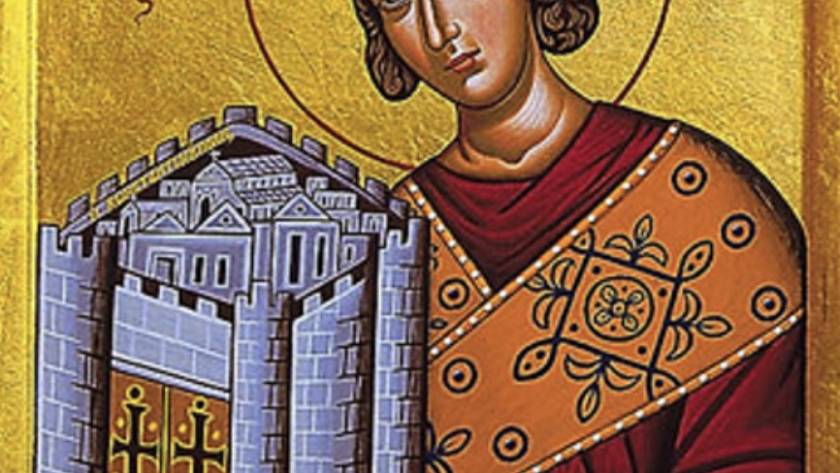 Icon of a saint holding a walled city, adorned in ornate robes, against a golden background