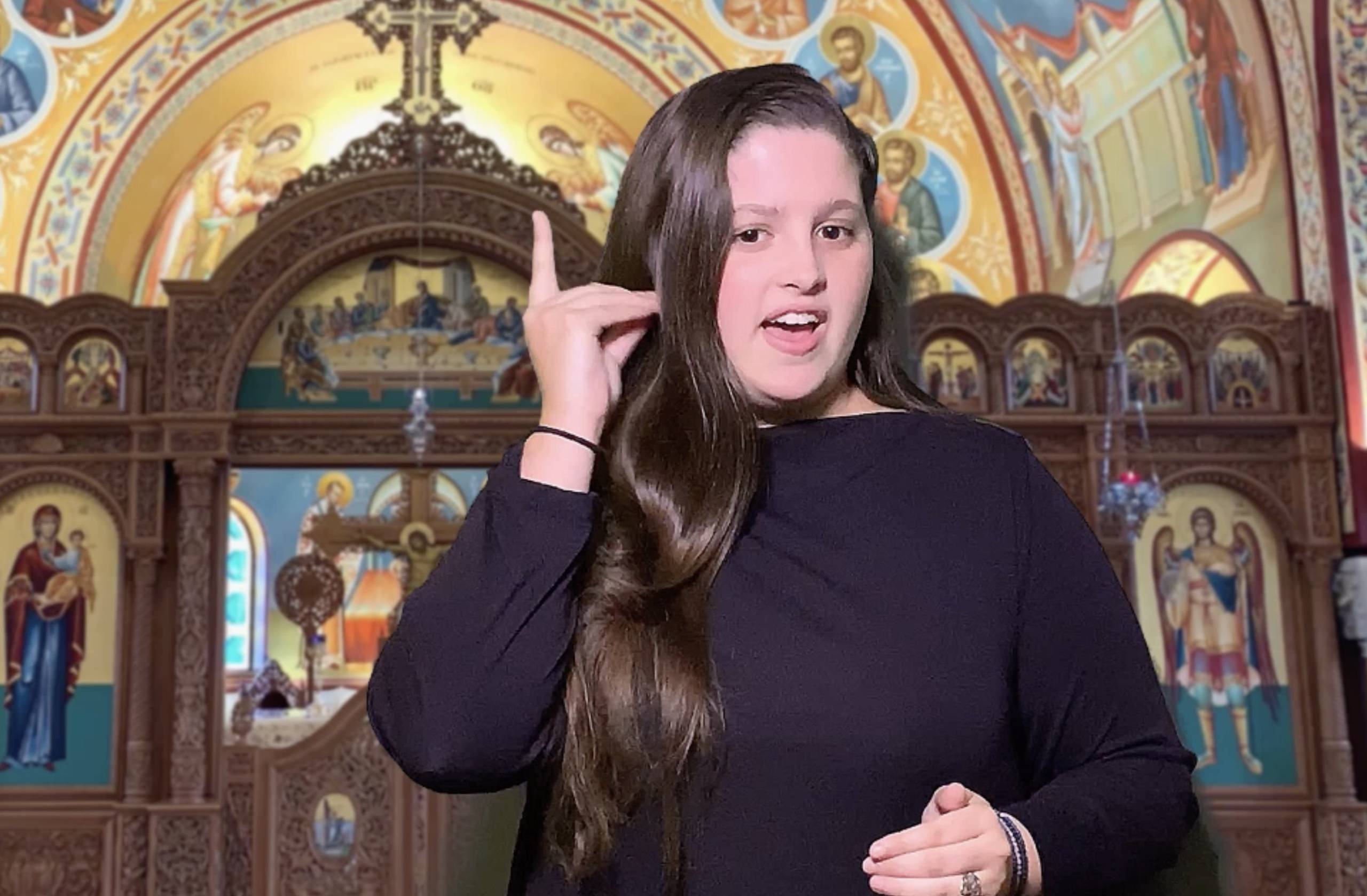 woman signing prayers for deaf in Orthodox Church