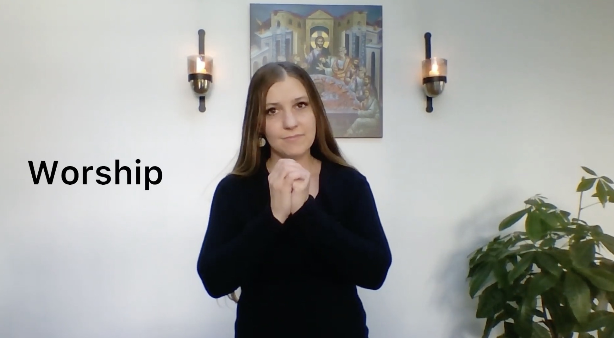 woman signing worship for the deaf