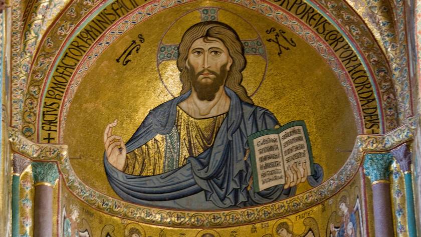 Mosaic of Christ Pantocrator in Monreale Cathedral, Sicily, depicting Jesus with a halo and a book in Byzantine style