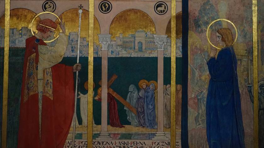 Religious mural featuring saints, a cityscape, and figures with halos in traditional robes and garments