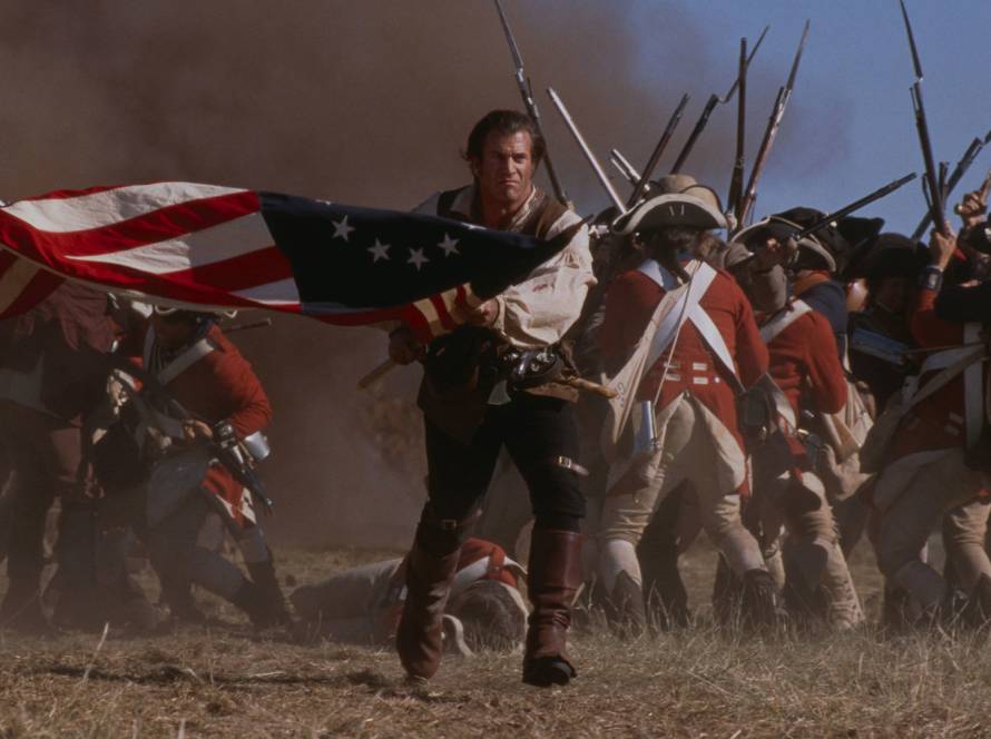 Revolutionary War soldier leading charge with flag amidst battle scene