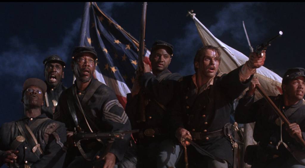 Civil War soldiers holding firearms and flags, standing determined under a dramatic night sky