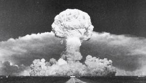 Mushroom cloud from a large explosion, black and white image depicting a significant event in history.