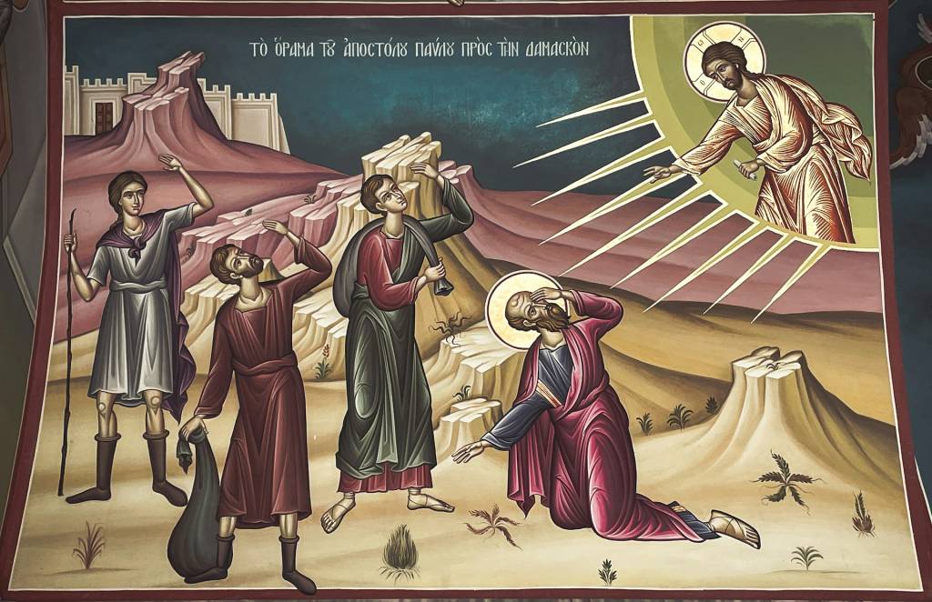 Religious painting of a biblical scene with figures and light rays symbolizing a spiritual event on a rocky landscape